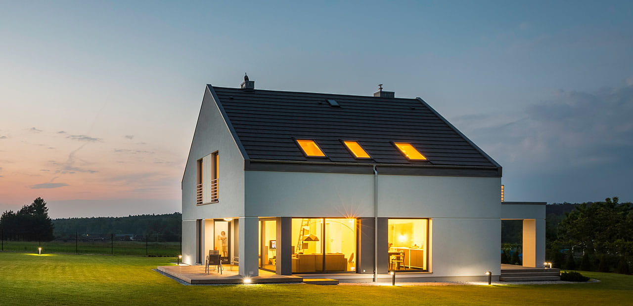 modern house with outdoor and indoor lighting, at night